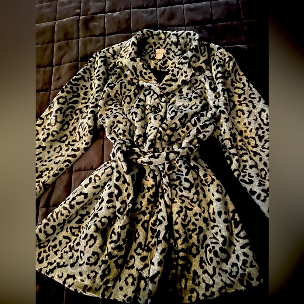 Never worn Chico’s size 3 faux fur blazer with three buttons and a tie.